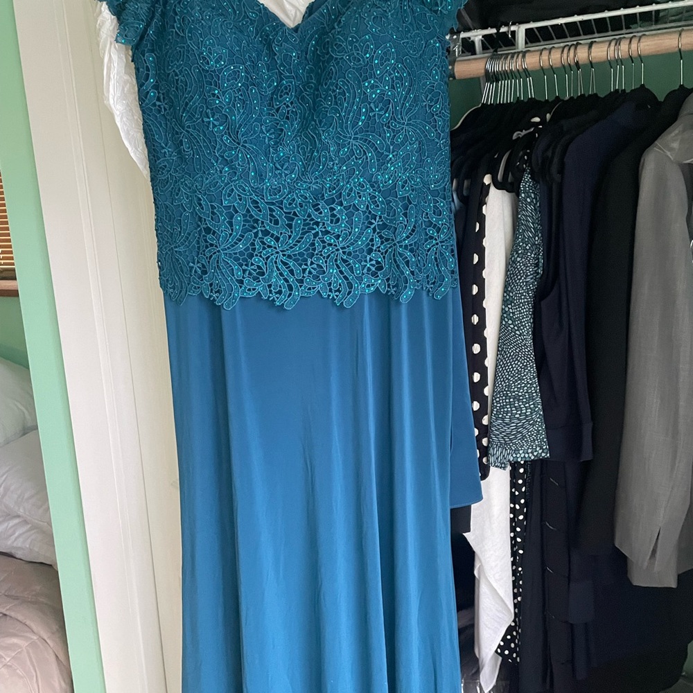 Ladies gown beautiful detail and color .